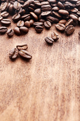 Coffee beans on wooden background
