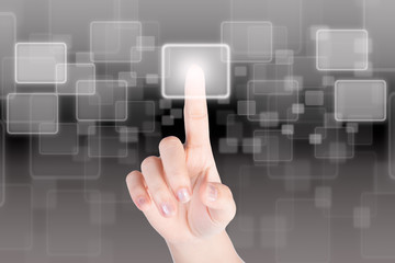 Hand pressing button with technology background