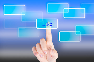 Hand pressing"Like" botton with technology background