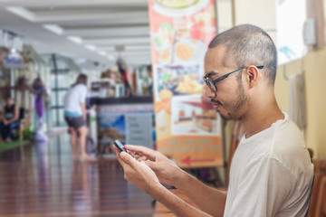 Asian man using smartphone