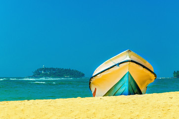 Exotic beach with fishing boat,  Sri Lank