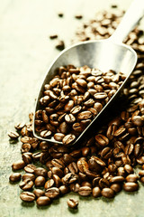 Coffee beans and metal scoop