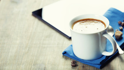Cup of coffe with Digital tablet computer and smart phone