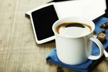 Cup of coffe with Digital tablet computer and smart phone