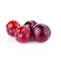 plums isolated on white