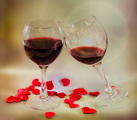 Glass with red wine and textile red valentine hearts