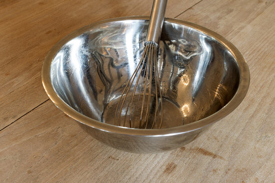 Whisk on wood table