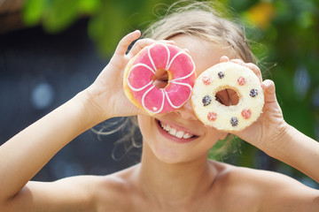 Girl eating donuts