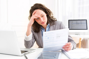 Young attractive woman doing paperwork