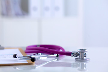 Doctor&amp;amp;#39;s stethoscope  with folder on the desk