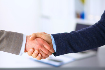 Business people shaking hands, finishing up a meeting