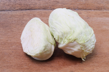 close up shot of a white collard on wood background.