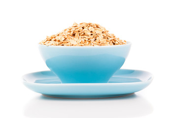 Cornflakes in porcelain bowl isolated on white background
