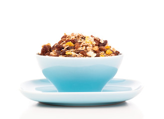 Cornflakes in porcelain bowl isolated on white background
