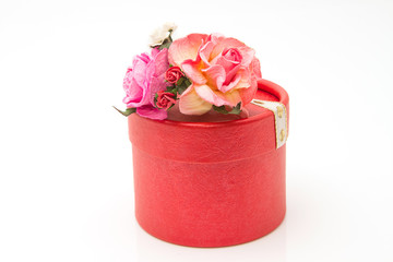 Flowers and gift box isolated on white