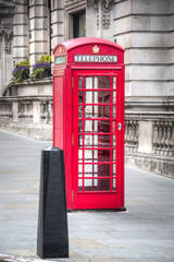 Typical red phone booth in London, UK
