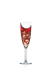 red wine splashing out of a glass, isolated on white