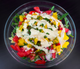 Fresh vegetable salad with sauce.
