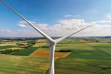 Fototapeta na wymiar Wind turbine on a field, aerial photo