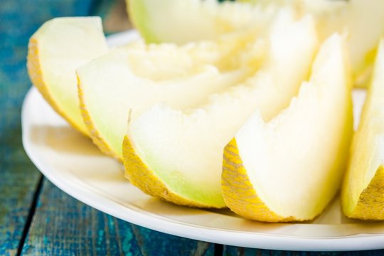 slices of fresh melon on a plate closeup
