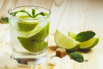 Fresh cocktail witn soda, lemon and mint, selective focus