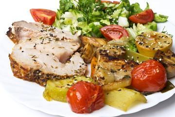 Roasted pork roulade with potatoes, tomato and mushroom 