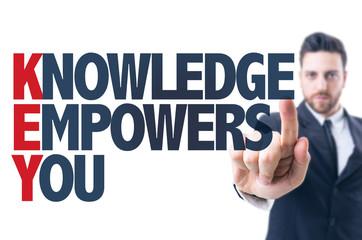 Business man pointing the text: Knowledge Empowers You