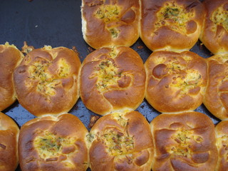 Tray with newly baked traditional cheese pies