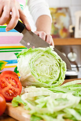 Woman's hands cutting vegetables
