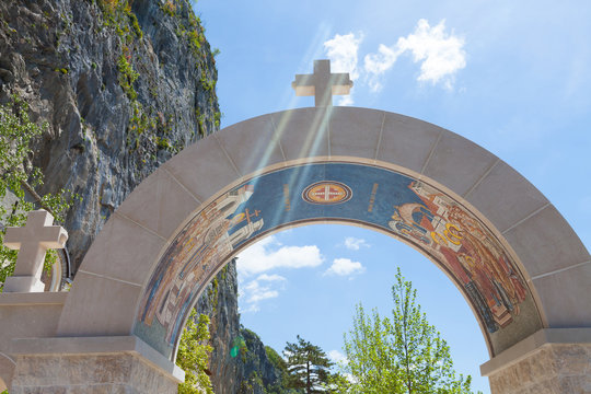 arch decorated with mosaics - entrance to the monastery Ostrog