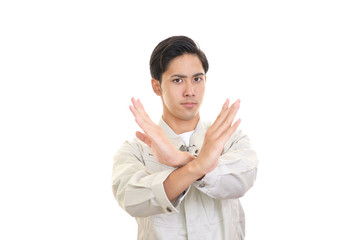 禁止の意思表示をする作業員