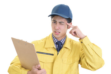 苦悩する作業員