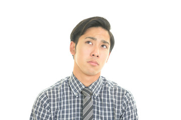 疲れた表情のビジネスマン