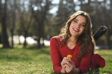 Woman rest in the park with dandelions