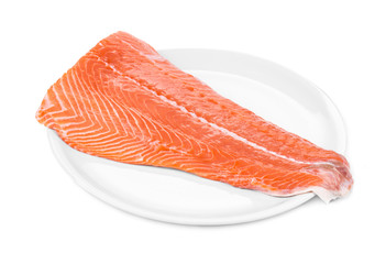 Raw salmon fillet on plate.