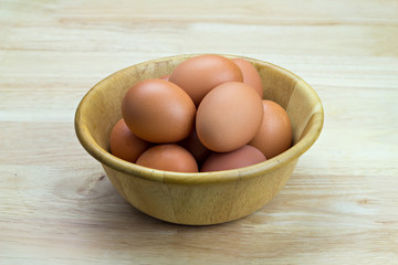 hen's eggs in wooden bowl