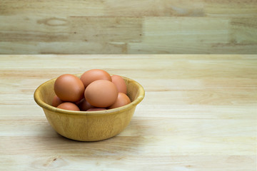 hen's eggs in wooden bowl