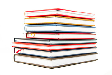 Stack of diaries on white background