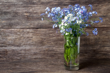 Forgetmenot flowers on a wooden background