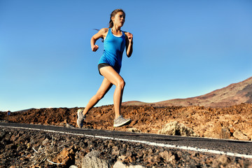 Running sprinting woman - female runner training