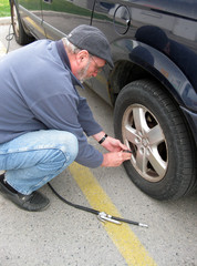 Measuring pressure in the tire prior to filling with air.