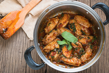 fried chicken with basil leaves