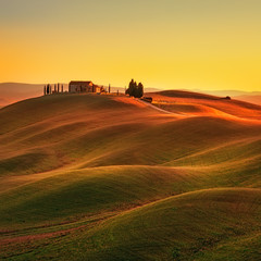Fototapeta na wymiar Tuscany, sunset rural landscape. Rolling hills, countryside farm