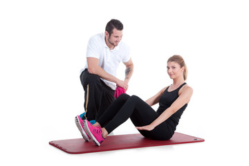 Obraz premium Trainer macht Gymnastikübung mit Frau Porträt