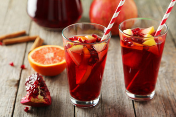 Glasses of sangria on grey wooden background
