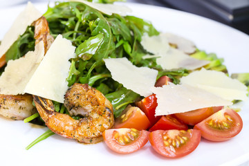 shrimp salad and greens on a white background