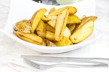 fried potatoes on a plate in a restaurant