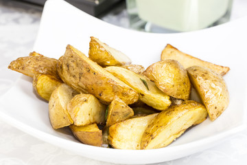 fried potatoes on a plate in a restaurant