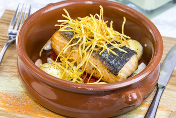 Baked salmon fillet with vegetables in a restaurant
