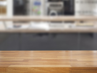 Fototapeta na wymiar Empty wooden table and blurred kitchen background